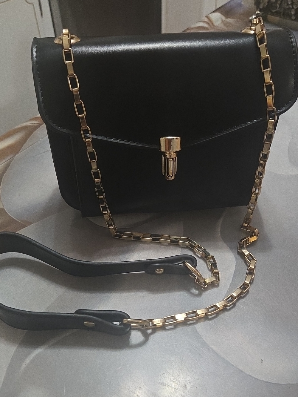 Elegant Black Leather Crossbody Bag with Gold Chain